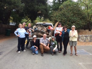 A few of the volunteers posing afterward with a truck full of trash removed from San Geronimo Creek. 