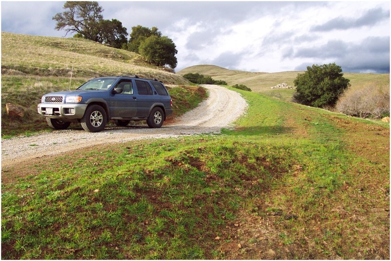 The same road is now out sloped with an even surface, with regular rolling dips.