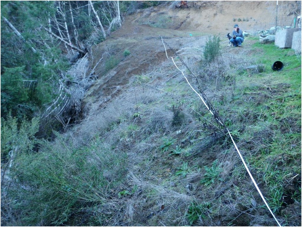 Another unstable, convex road bank is shown.